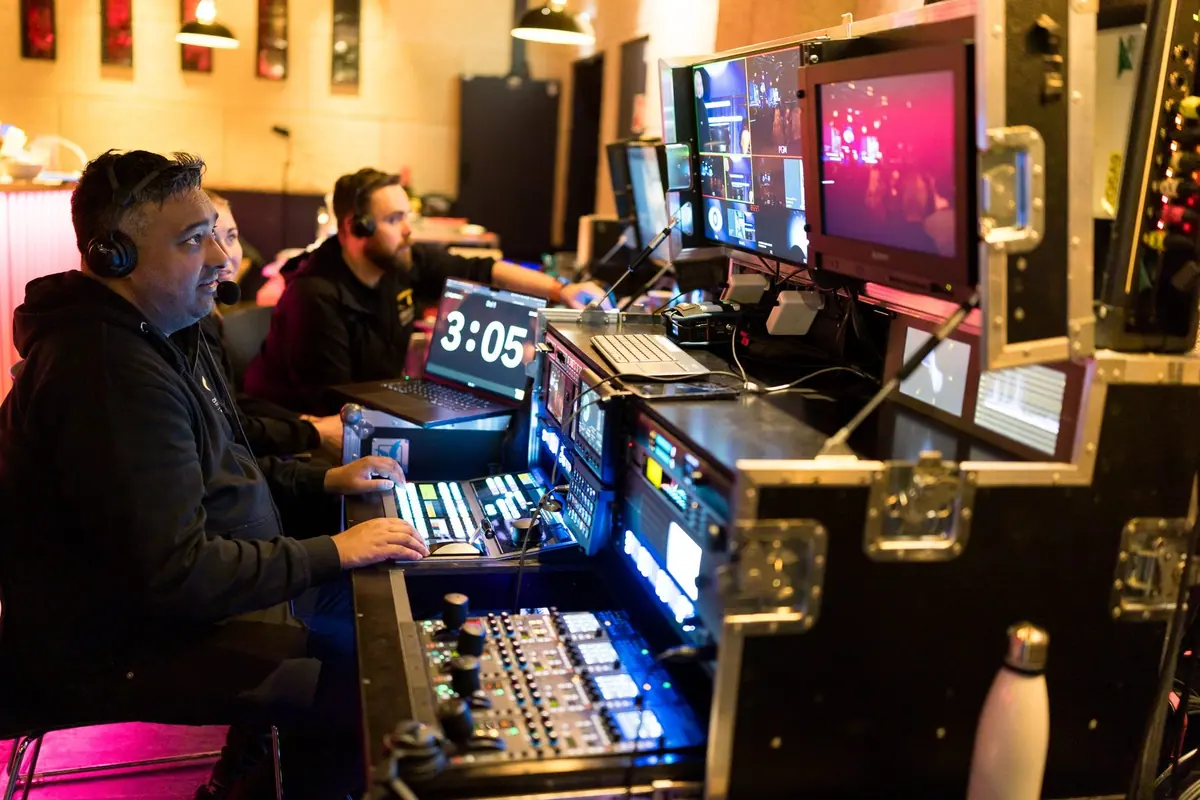 Technicians at the vision mixer and control desk during the Aarebrot Lecture