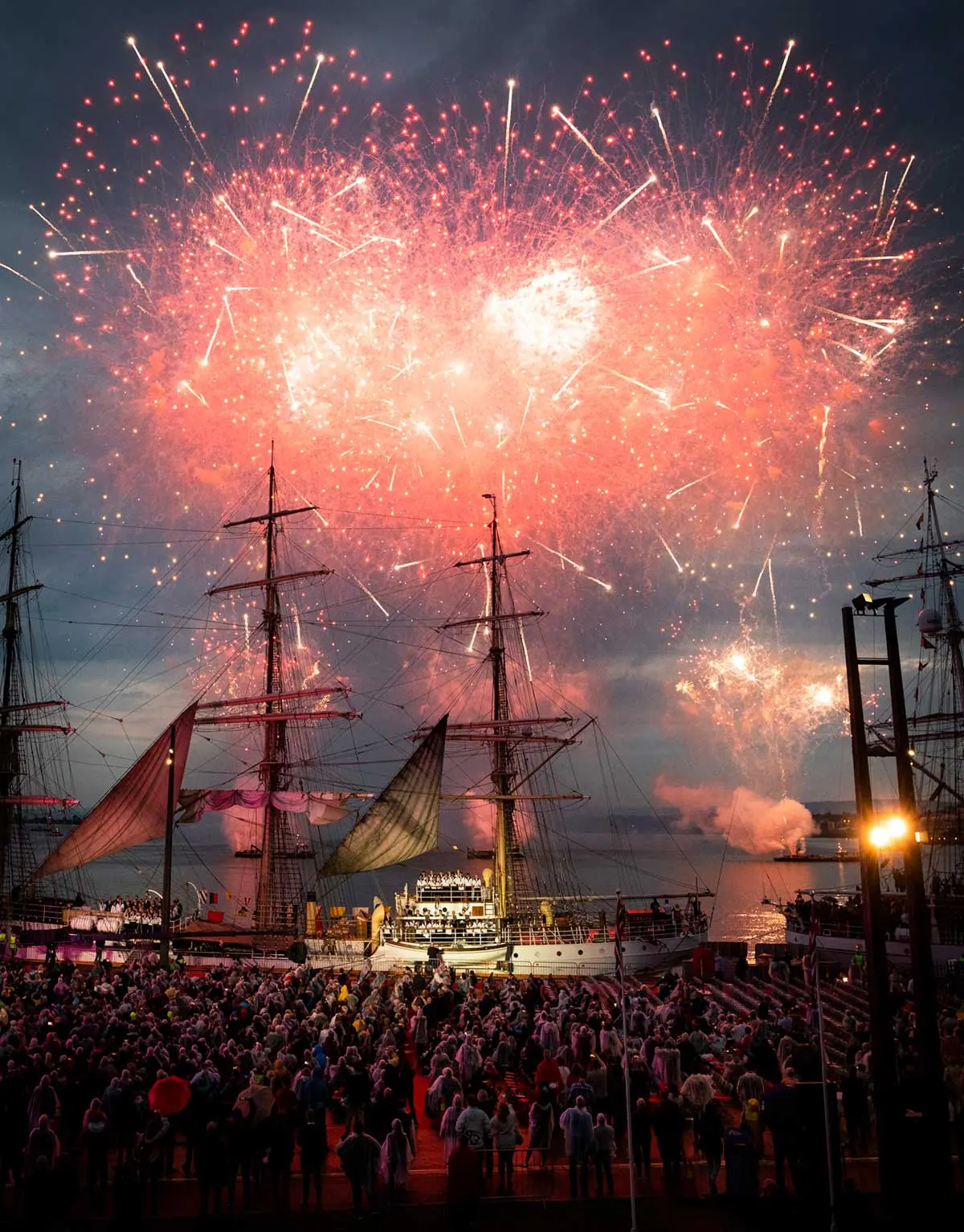 Fireworks over tall ships and the crowd at the Nor-Shipping opening ceremony