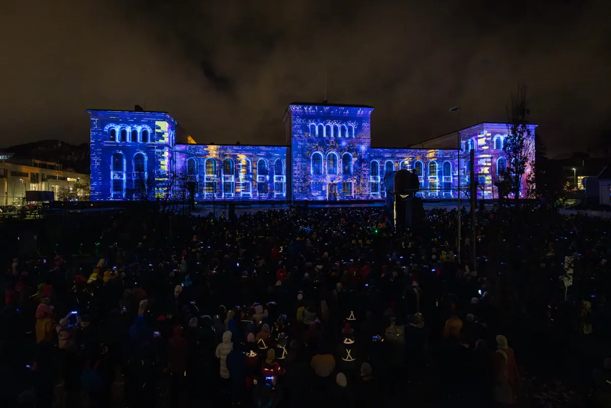 The University Museum in blue and purple light before thousands of spectators