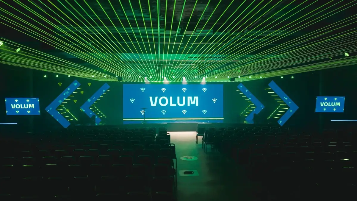 Green laser canopy over the conference hall and Volum screens on stage in the car park